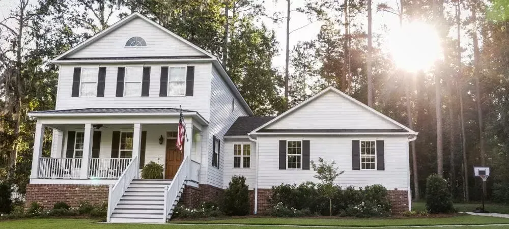 White house with a beautiful yard